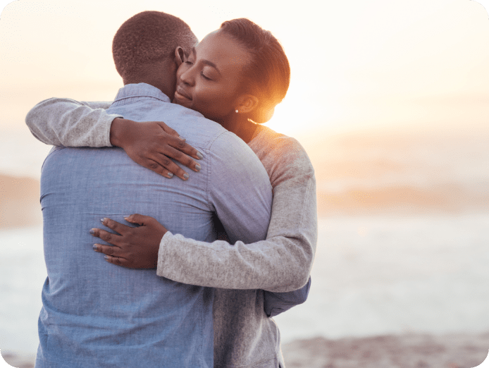 gent and lady hugging outdoors after getting a diaspora last expense claim paid